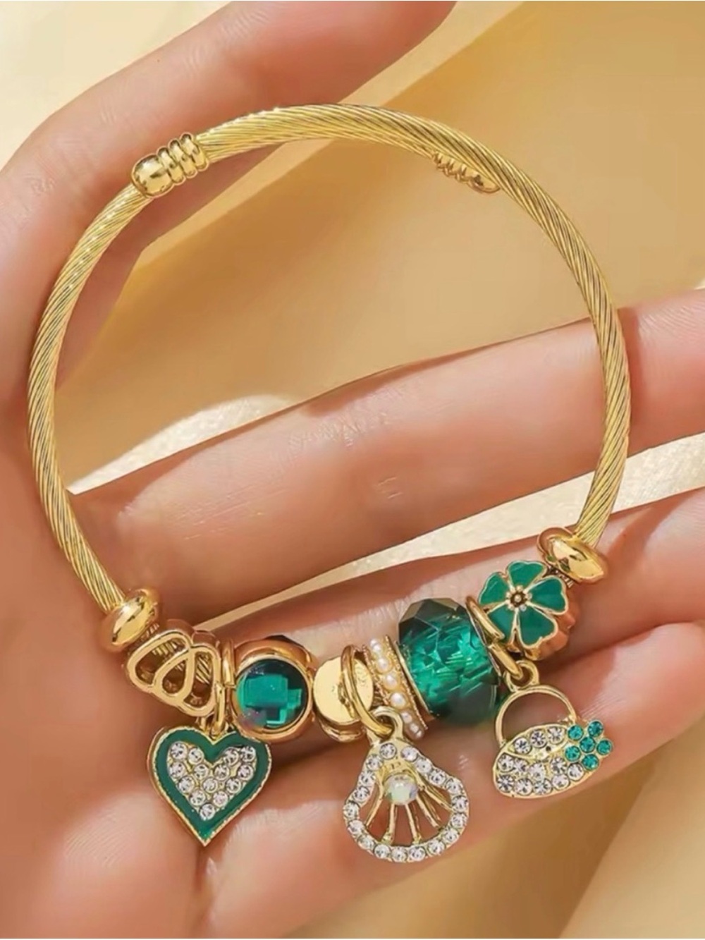 Gold-Tone Green Charm Bracelet with Crystal Accents